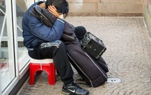 man sleeping with guitar